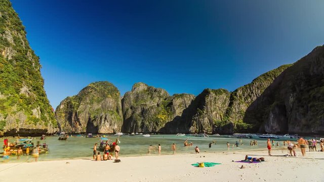 Timelapse of the Maya bay beach with tourists on Phi Phi Ley Island, Thailand.