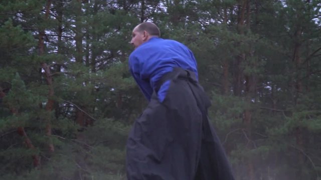 The balding samurai avoids from the hits of a heavy halberd