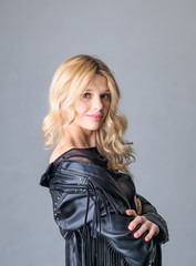 Fototapeta premium Young woman in a black leather rocker jacket.