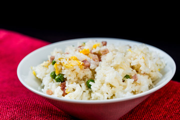 Homemade Chinese fried rice with vegetables and fried eggs