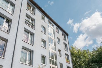 low angle view of apartment house with glass staircase