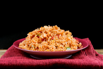 Homemade Chinese fried rice with vegetables and fried eggs