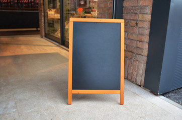 Fototapeta na wymiar Blank board menu mock-up, stand at the entrance of the restaurant