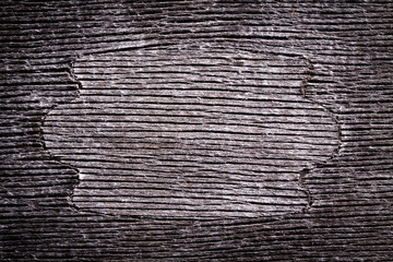 Gray wooden background with densely cracked surface texture.