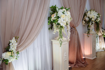 Beautiful decorated wedding restaurant for marriage. Colorful decoration for celebration. Beauty bridal interior. Concept of style of banquet hall