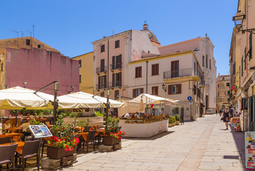 Alghero, Sardinia, Italy. Summer restaurant in the historical center - obrazy, fototapety, plakaty
