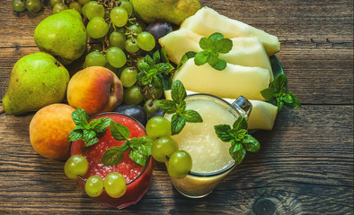 Watermelon and melon smoothies. On a wooden surface. From above