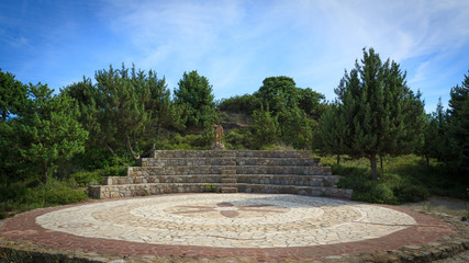 Small outdoor greek theatre in garden.