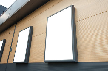 Isolated billboards at the shopping center wall. Mockup for marketing campaign promotion