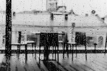 Cafe on the open terrace of the shopping center on a rainy day