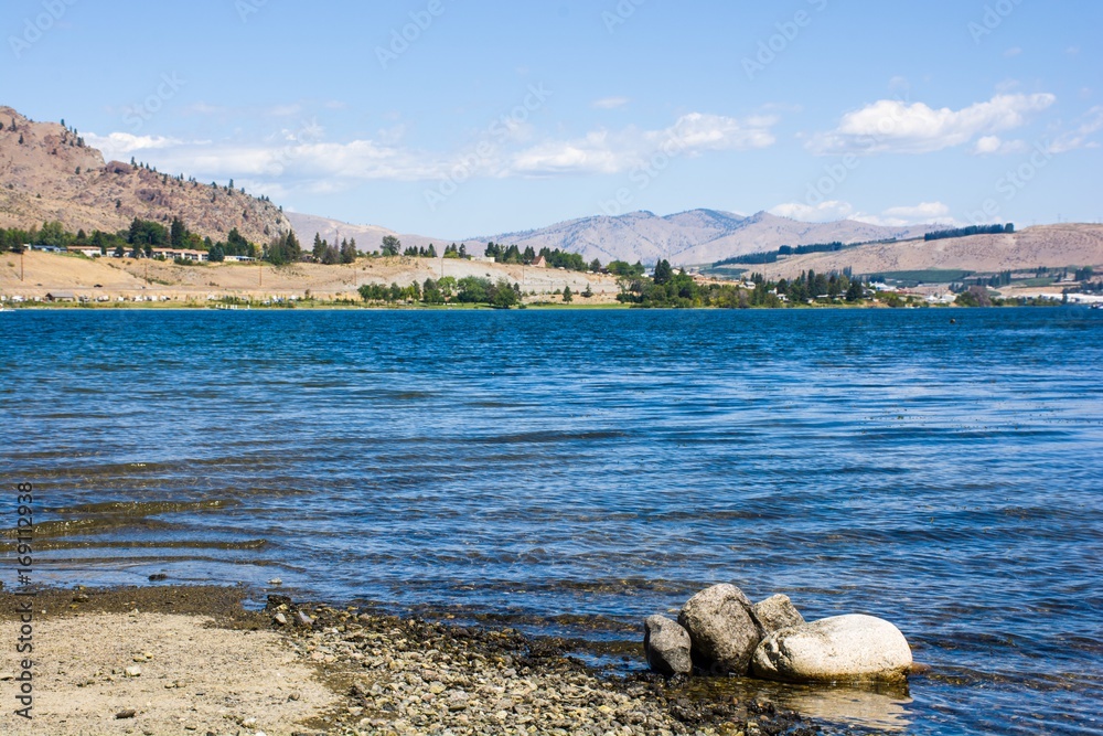 Wall mural landscape the mountains with the rock and blue lake