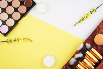 Feminine beauty background concept. Cosmetics laced with flowers. Top view, flat lay.