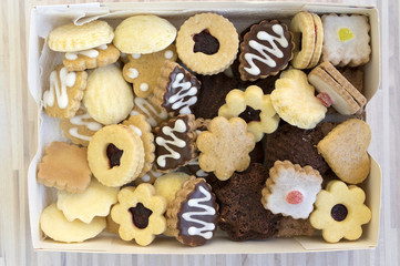 Many kinds of Christmas cookies in one pile in the box