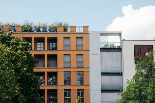 modern apartment building exterior with orange facade