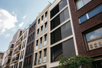 street full of real estate houses with modern facades