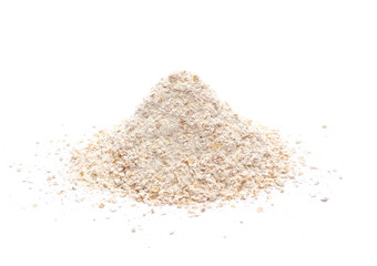 Pile of integral spelt wheat flour in wooden spoon isolated on white background