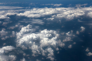 Obraz na płótnie Canvas Blue sky and white clouds view from the airplane window