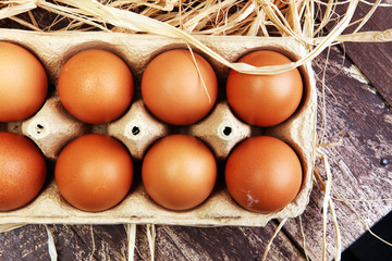 Egg. Fresh farm eggs on a wooden rustic background