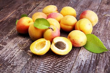 Delicious ripe apricots on wooden table. Fresh cut apricot fruits