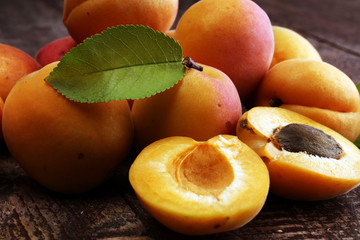 Delicious ripe apricots on wooden table. Fresh cut apricot fruits