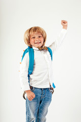 School, kid, rucksack. Little Boy dressed in  bow tie. Cheerful smiling little kid with big backpack. Looking at camera. School concept. Back to School