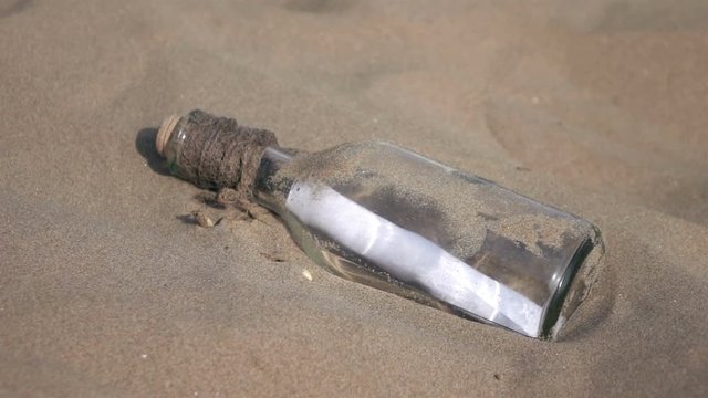 High quality video of message in the bottle on the beach in real 1080p slow motion 250fps.  More videos from this series in my portfolio