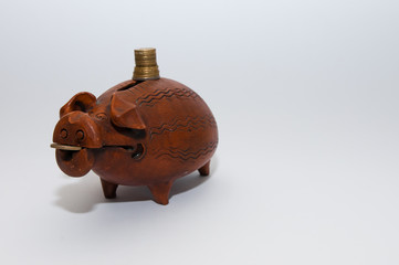 Ceramic piggy bank with coins