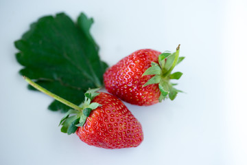 Strawberries with leaves.