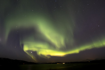 Aurora borealis above snowy islands of Lofoten,Norway
