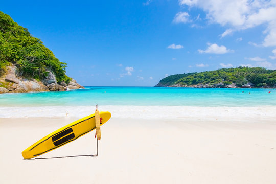 surfe board on the white sand beach 