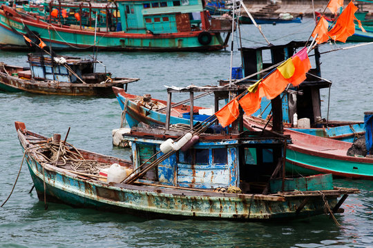 traditional colorful Vietnamese fishing boats in Ben Ngu wharf of Nam Du Islands, Kien Giang, Vietnam. Nam Du has become a popular tourist attraction, but foreigner are only allowed in with a permit.