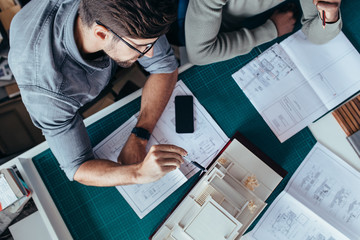 Architects working on new architectural house model