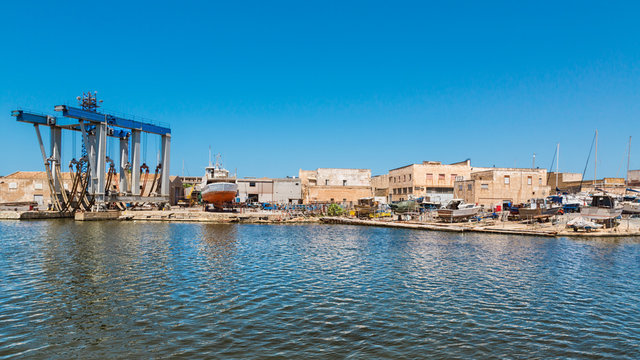 Mazara del Vallo (Italy) - Day view of canal, fishing boats and downtown