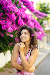 Beautiful girl in violet flowers