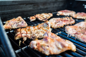  Delicious pork steaks on the grill 
