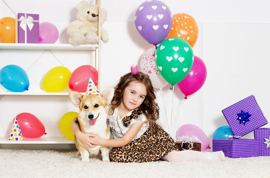 child and dog celebrate birthday