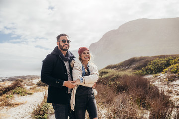 Romantic couple admiring a view at the beach © Jacob Lund
