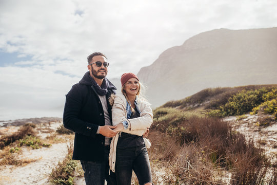 Romantic couple admiring a view at the beach