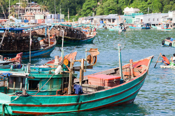 Fototapeta na wymiar traditional colorful Vietnamese fishing boats in Ben Ngu wharf of Nam Du Islands, Kien Giang, Vietnam. Nam Du has become a popular tourist attraction, but foreigner are only allowed in with a permit.