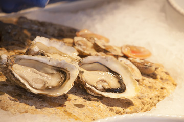 Two open oysters, ready to be eaten raw.
