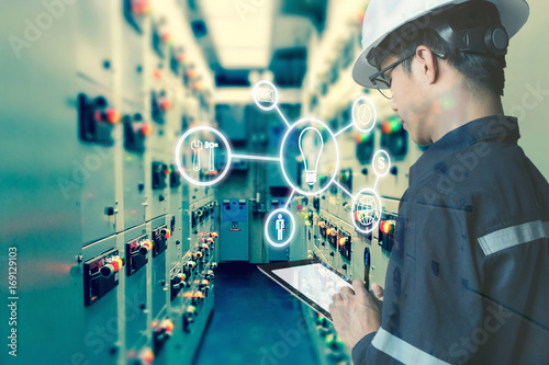 Double Exposure Of Engineer Or Technician Man Using Tablet