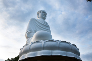 Fototapeta premium statue of the Buddha against the blue sky. Temple of the Buddha. Vietnam, Nha Trang, Pagoda.