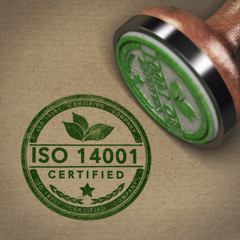 Certified Company Label, 3D illustration of a rubber stamp with the text ISO 14001 over brown cardboard background - obrazy, fototapety, plakaty