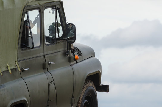 MILITARY OFF-ROAD VEHICLE - Car on a dirt road 