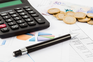 Monthly budget spreadsheet, money, pen and calculator