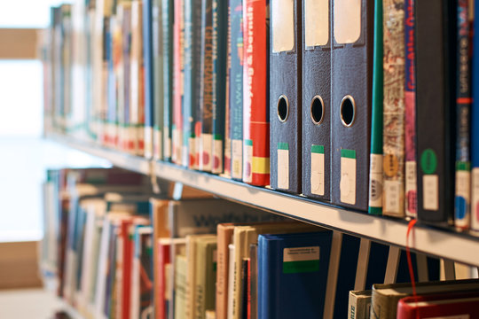 Box File Folders With Labels On A Bookshelf In A Library