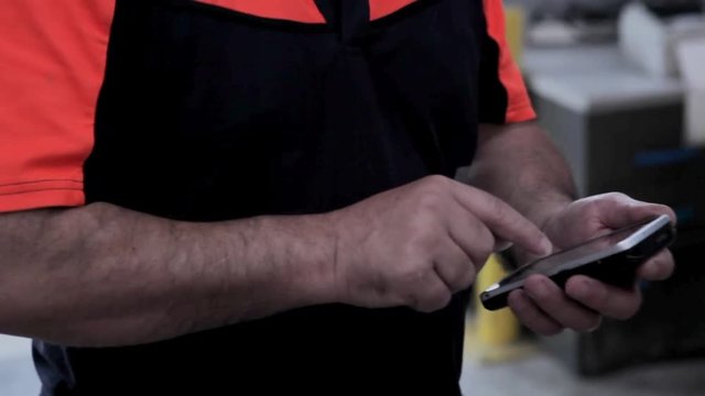 Worker handling a pda