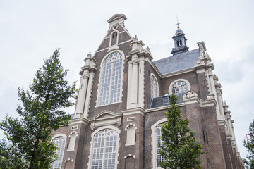 Fototapeta premium Beautiful Church in the city center of Amsterdam - AMSTERDAM - THE NETHERLANDS - JULY 20, 2017