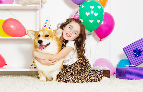 baby gently hugs a dog celebrate a birthday