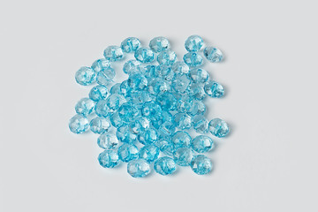 blue acrylic beads on a white background